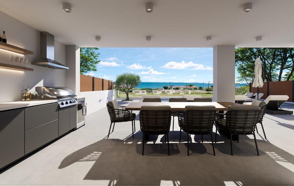 a kitchen and dining room with a table and chairs at Villa Morena in Kypseli