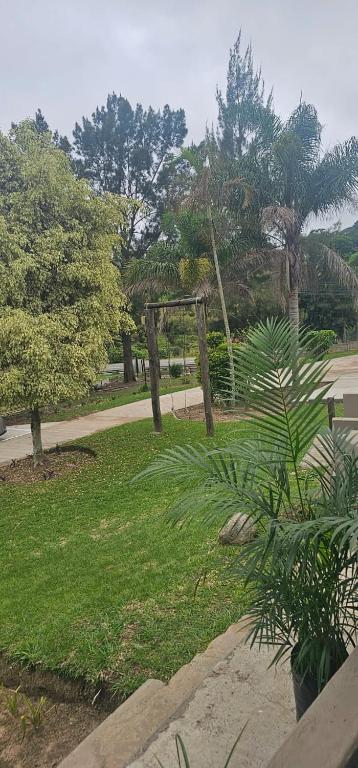 a park with a fence and plants in the grass at Phola La Bed and Breakfast in Melmoth