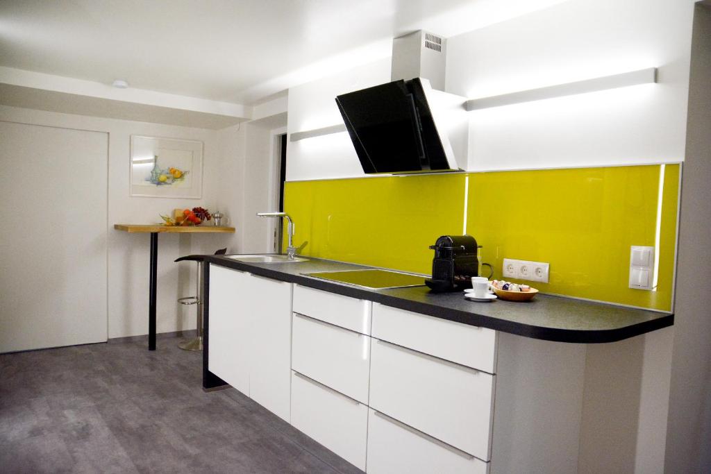 Kuchyňa alebo kuchynka v ubytovaní Gerda Wellness Apartment