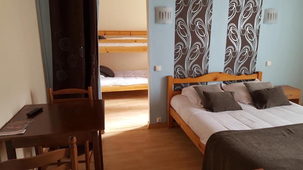 Postel nebo postele na pokoji v ubytování Hotel Ô Fil de L'ô