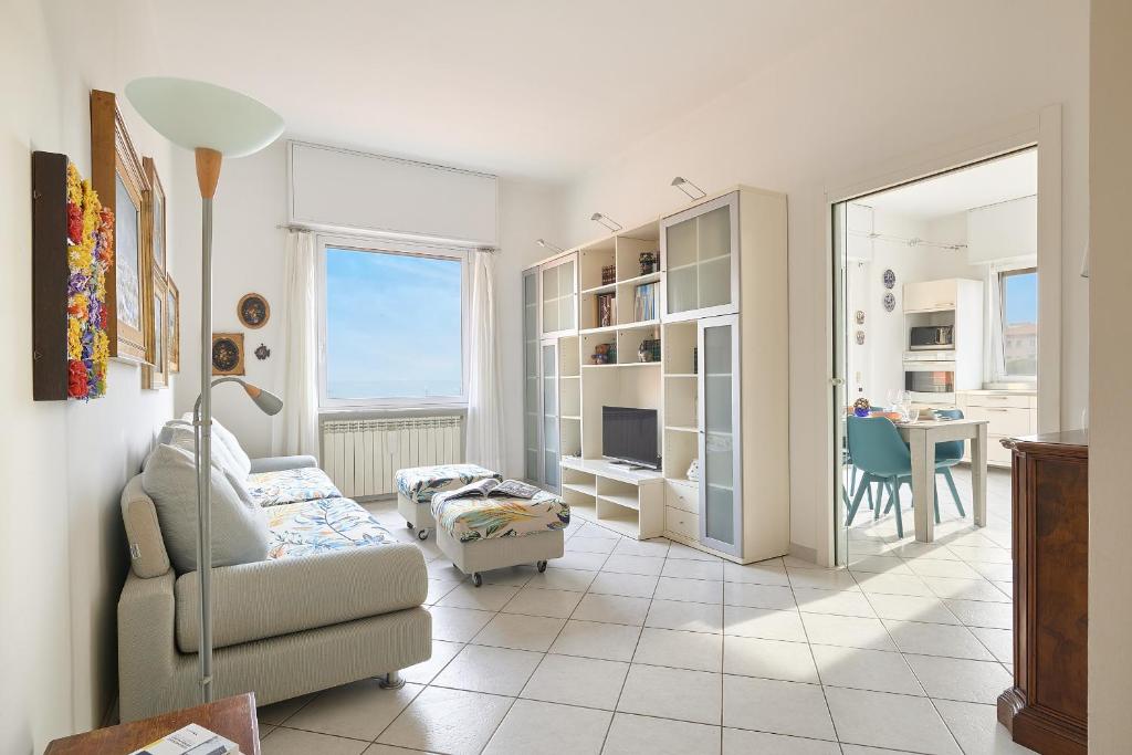 a living room with a couch and a table at SottoVento in Imperia