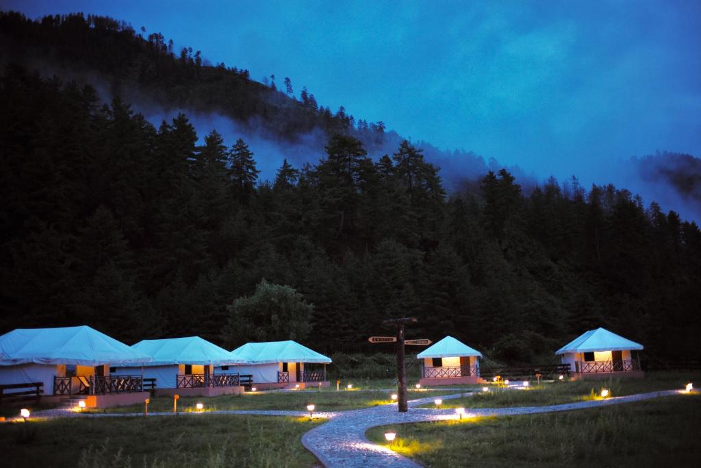 a group of tents with lights at night at Haa Valley Camp in Kechungka