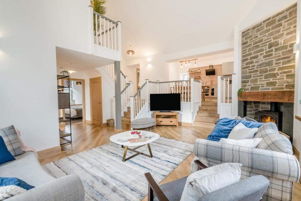 a living room with two couches and a tv at 3 Bed in Dunning oc-t35973 in Dunning