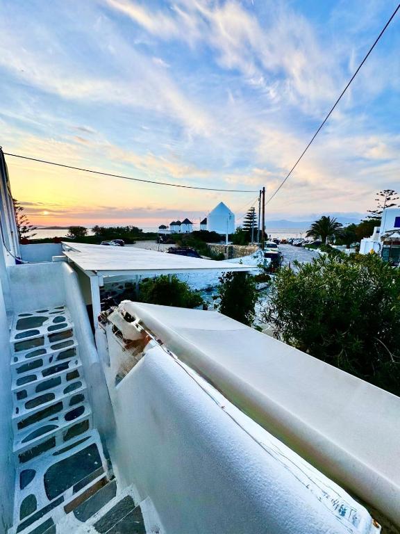 a view from the roof of a building with the sunset at Anna in Megali Ammos