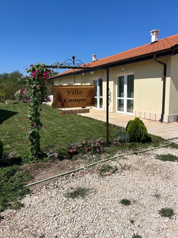 a building with a sign that reads wine country at Villa Alba in Ezerets