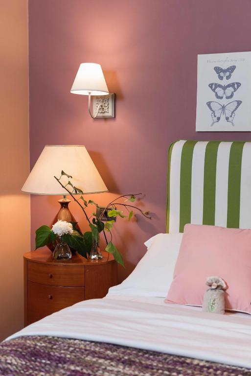 Postel nebo postele na pokoji v ubytování Areela Boutique Hotel
