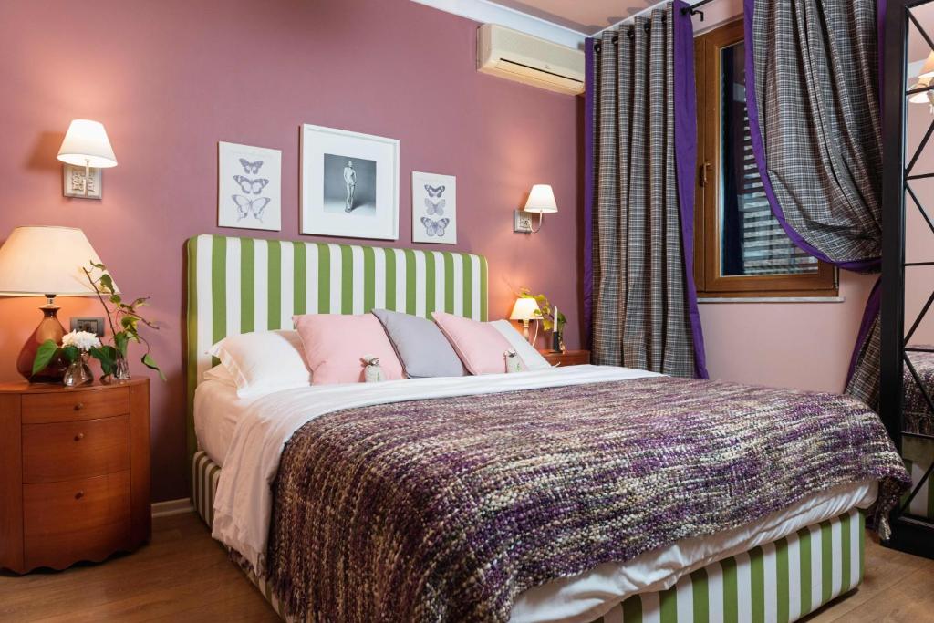 Postel nebo postele na pokoji v ubytování Areela Boutique Hotel