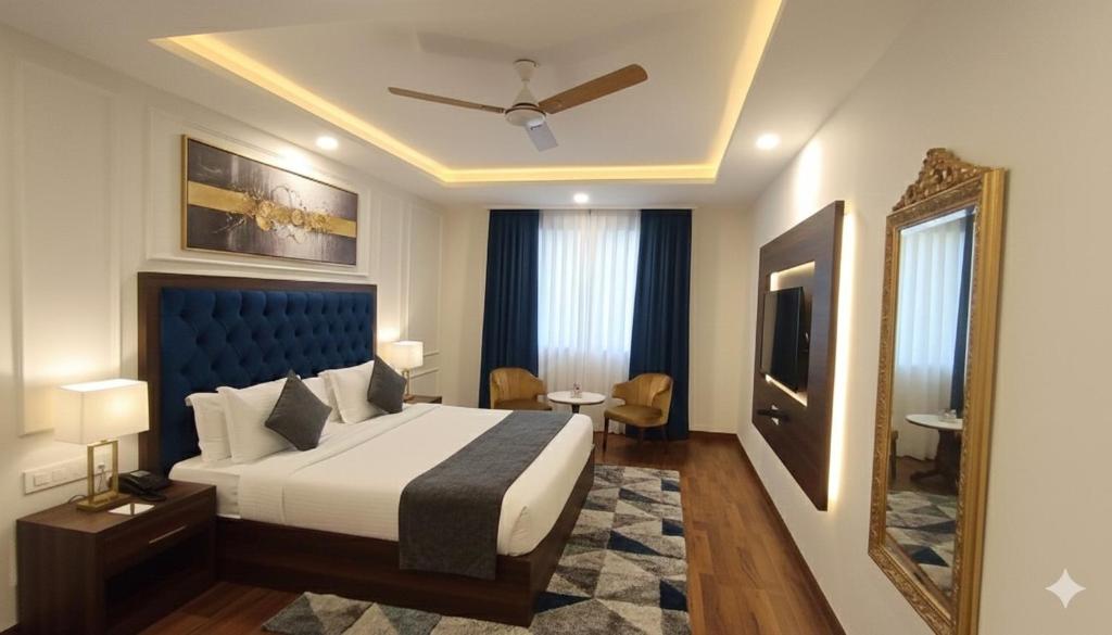 a hotel room with a bed and a mirror at Hotel The Tark Near Delhi Airport in Champawat