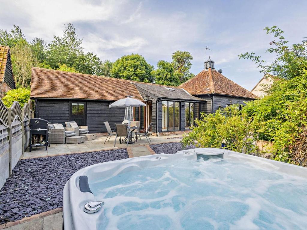a hot tub in the backyard of a house at 1 Bed in Dunmow oc-51222 in Thaxted