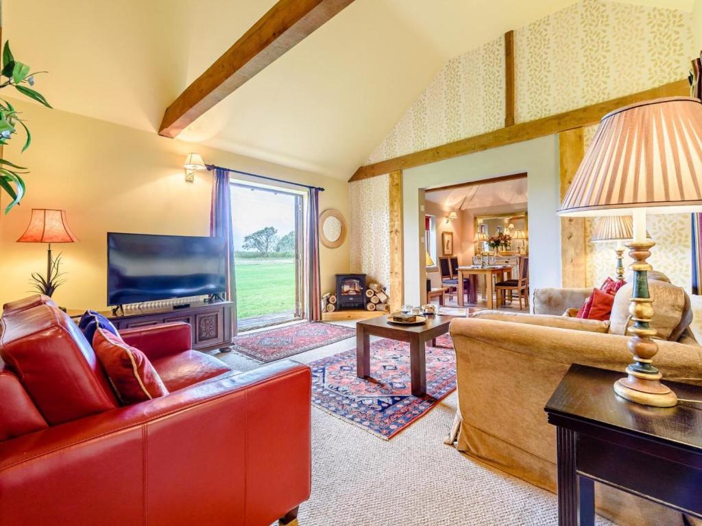 a living room with a couch and a tv at 2 Bed in Bedford oc-79558 in Wyboston