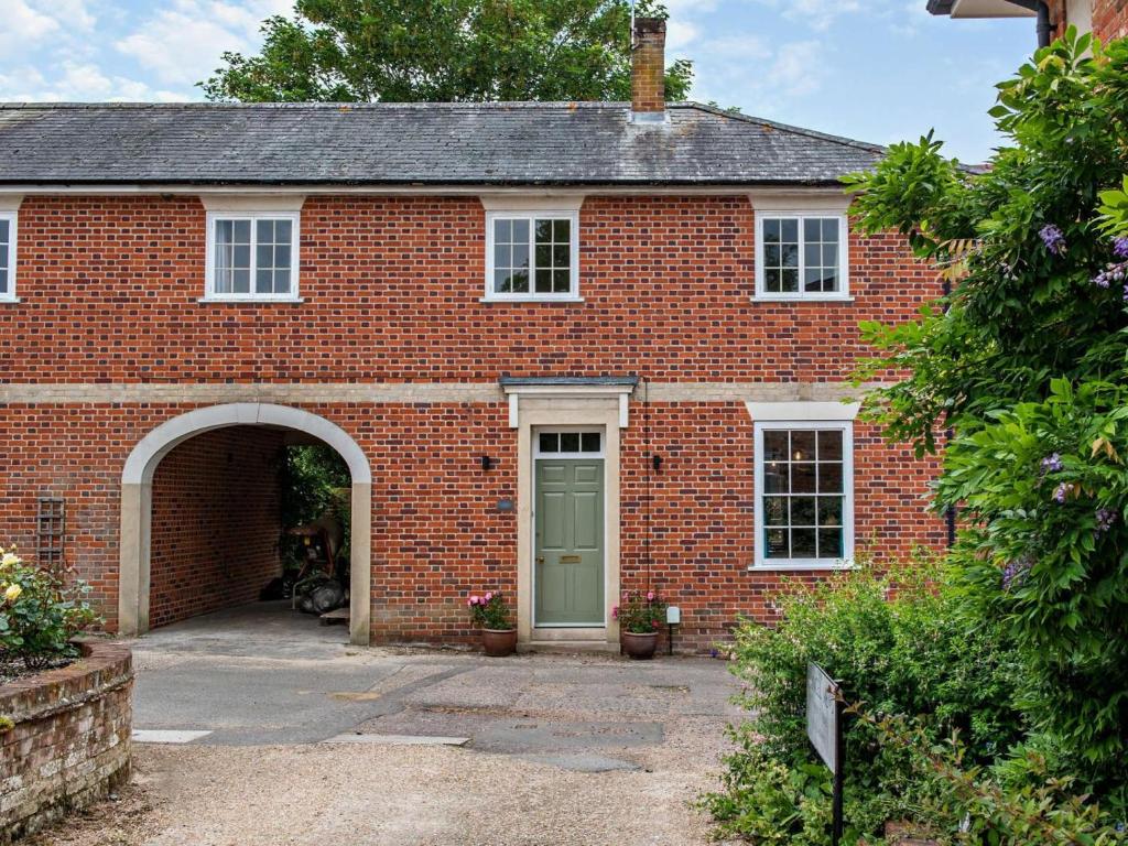 a red brick house with a green door at 3 Bed in Colchester oc-94016 in Dedham