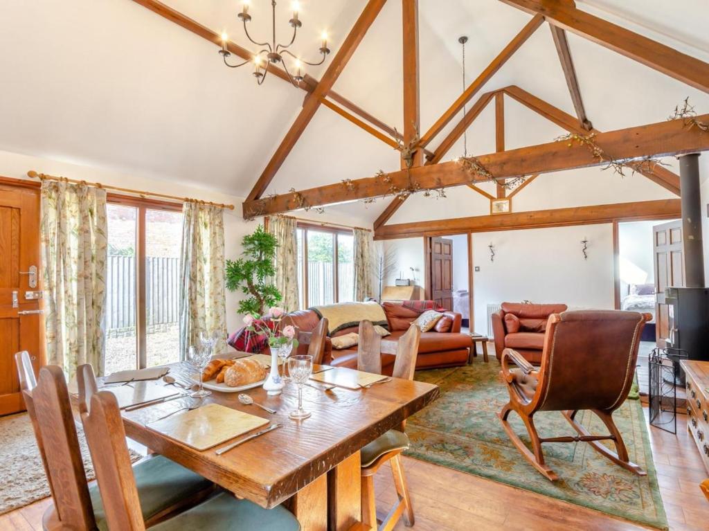 a dining room with a wooden table and chairs at 2 Bed in Lincoln oc-93058 in Saxilby