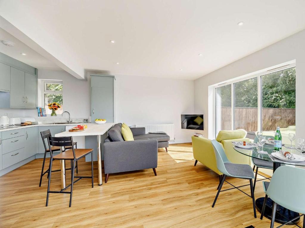 a kitchen and living room with a table and chairs at 2 Bed in Mablethorpe oc-93143 in Trusthorpe