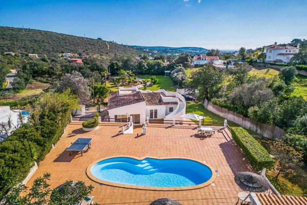 an aerial view of a house with a swimming pool at Casa Jardim in Loulé