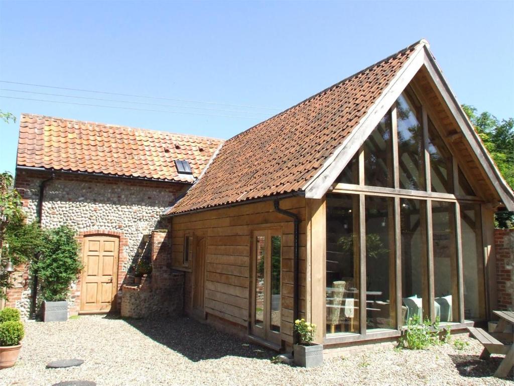 an extension to a house with a garage at 2 Bed in Holt oc-ncc39 in Cley next the Sea