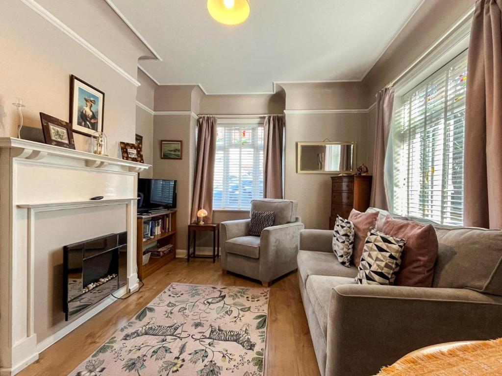 a living room with a couch and a fireplace at 1 Bed in Broadstairs oc-89359 in Broadstairs