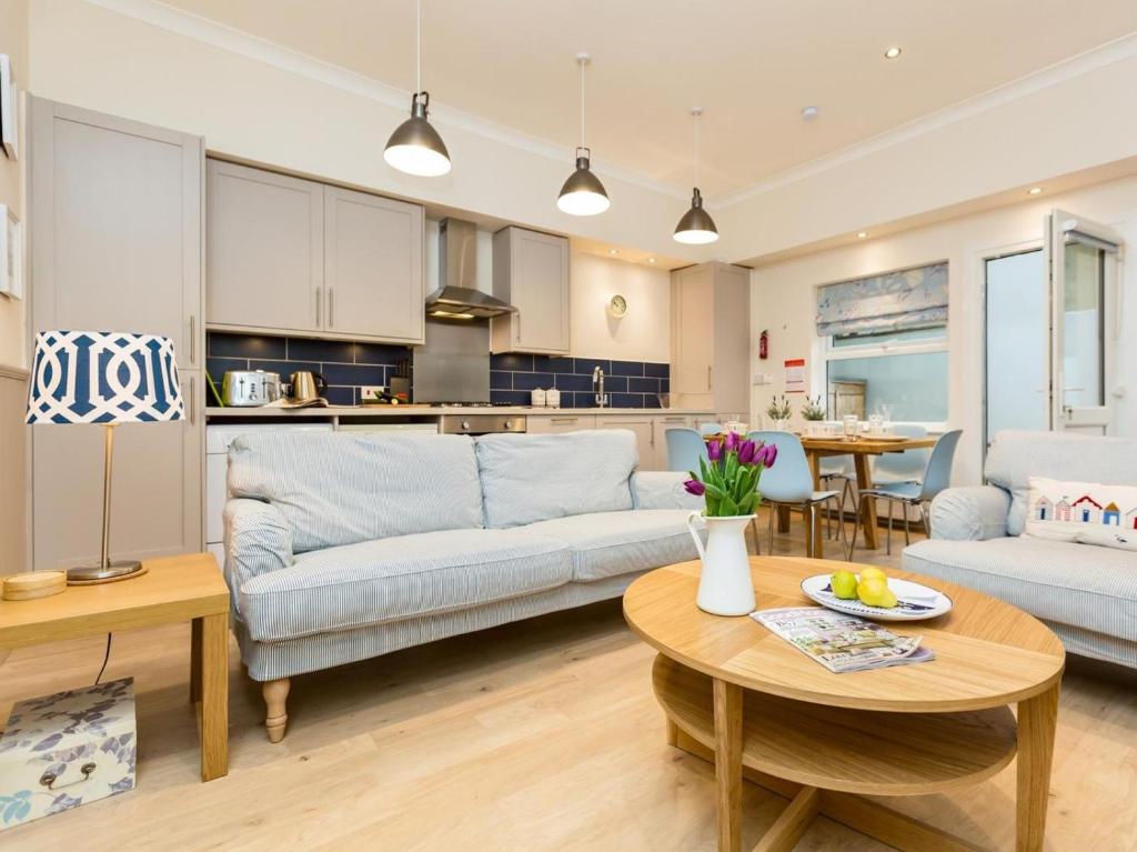 a living room with a couch and a table at 3 Bed in Eastbourne oc-ehc38 in Eastbourne