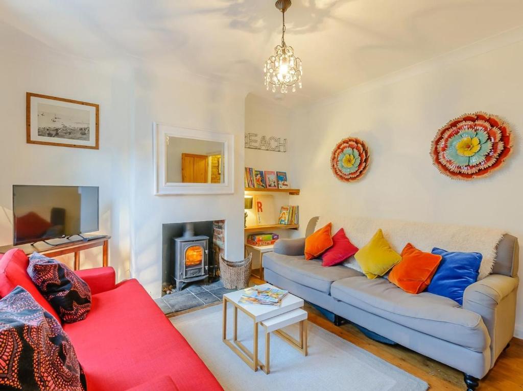 a living room with a couch and a fire place at 3 Bed in Whitstable oc-84042 in Whitstable