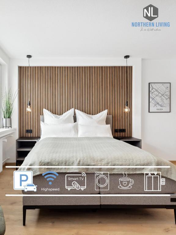 a bedroom with a large bed with a wooden headboard at Modernes Studio am Bremer Dom mit Balkon in Bremen