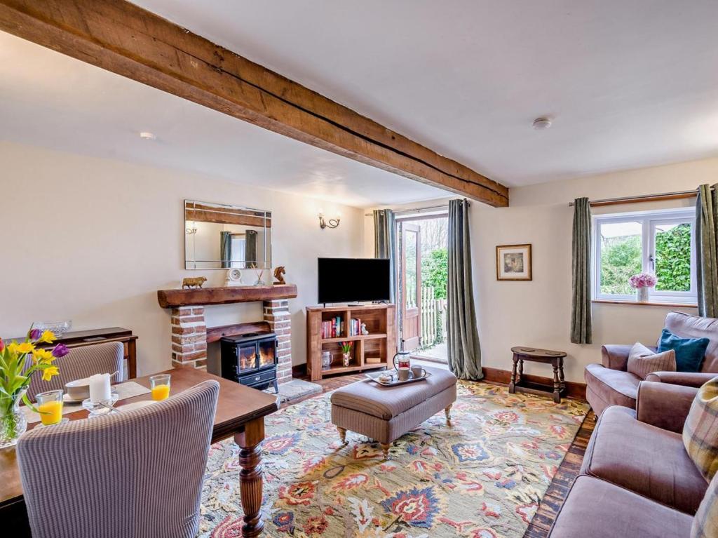 a living room with a couch and a table at 1 Bed in Thetford oc-57889 in Saham Toney