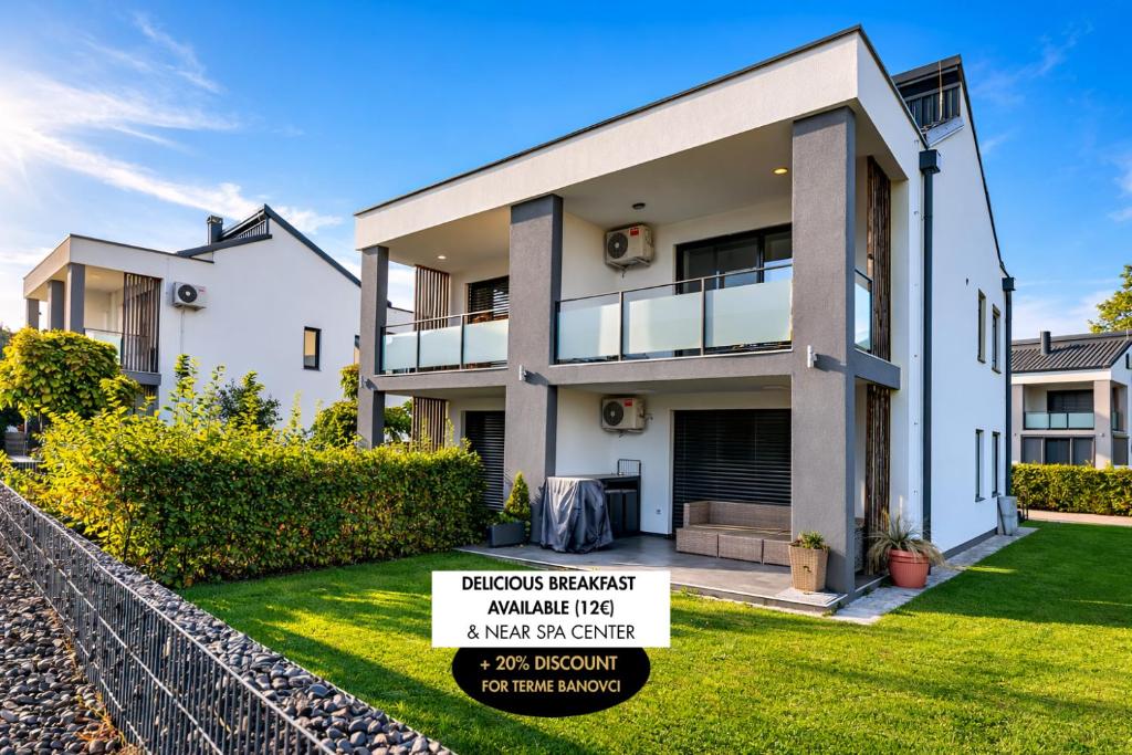 a house for sale with a sign in front of it at White Mountain Apartment in Banovci