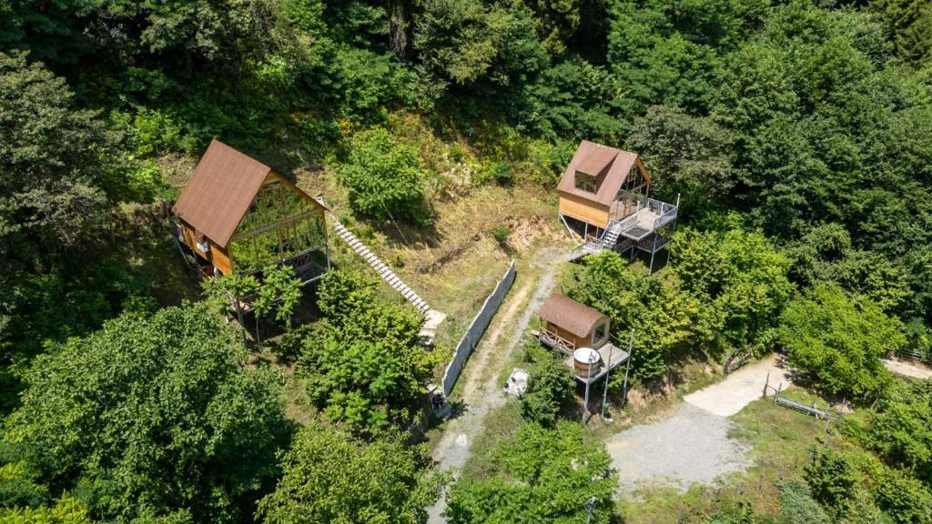 an overhead view of a house in the forest at Cliffside - ქლიფსაიდი in Makhunts'et'i