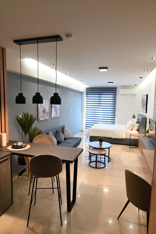 a living room with a table and a couch at Efanton 3 in Larisa