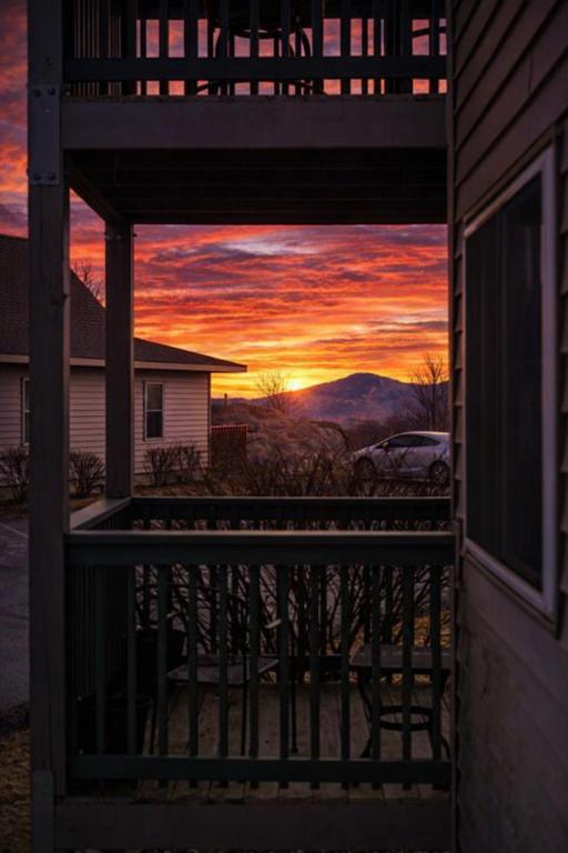 a view of a sunset from the porch of a house at Beech Mountain Studio - Trails, Concerts & Bike Park in Beech Mountain