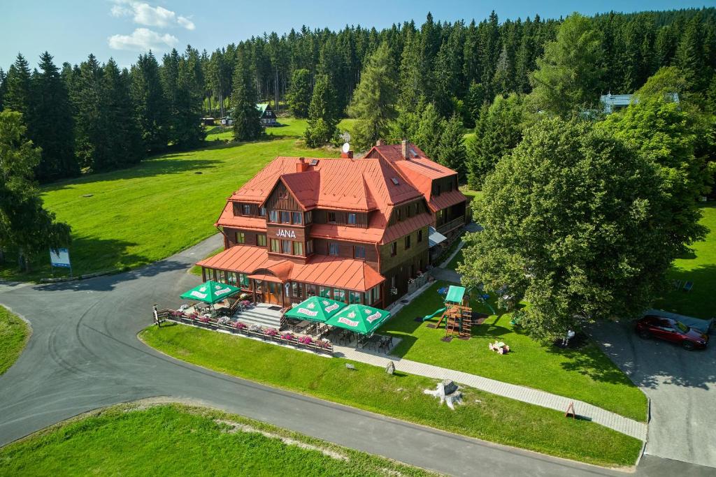 an overhead view of a large house with a roof at Hotel Bouda Jana in Pec pod Sněžkou