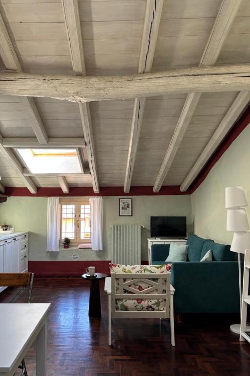 a living room with a couch and a table at BoscoLago apartment Lake Iseo & Franciacorta in Iseo