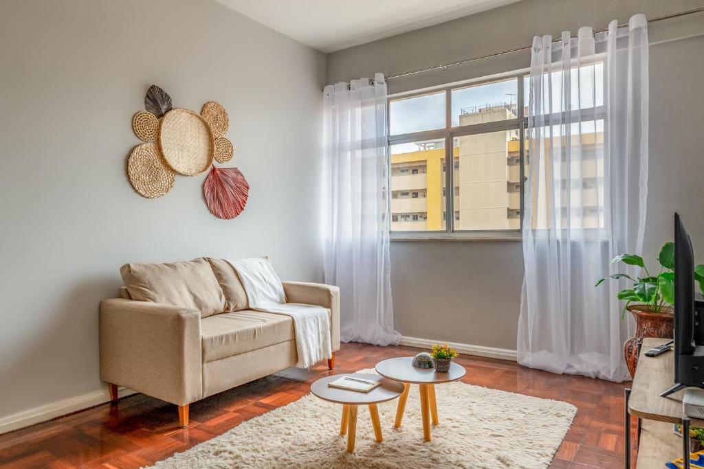 a living room with a couch and a window at Apartamento Canto da Chaco | by Aquarela Stays in Belém