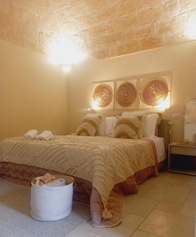a bedroom with a large bed in a room at Radici Cave & Suite in Matera