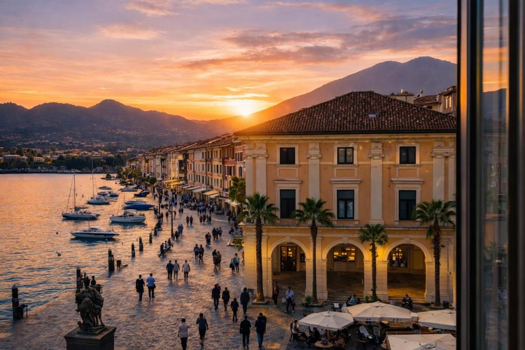a group of people walking down a street next to a body of water at DIMORE DEL CENTRO - Domus Coeli in Salò