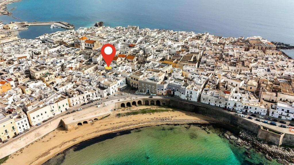 an aerial view of a city with a red marker at Domus Gallipoli by Casa di Marco in Gallipoli