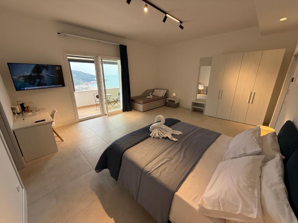 a bedroom with a large bed with a swan on it at Suites Prestige in Peschici