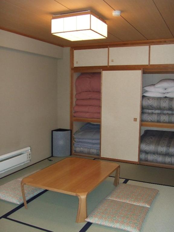 Postel nebo postele na pokoji v ubytování Sundance Resort Kawaguchiko