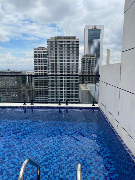 a large swimming pool on the roof of a building at Luxeliving Homes in Nairobi