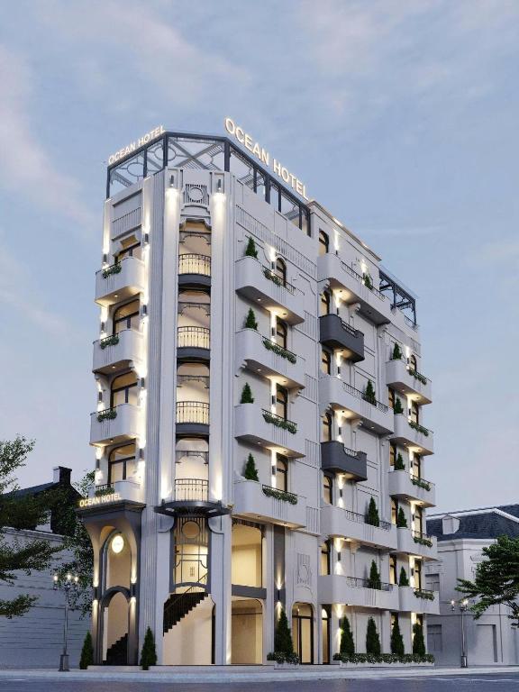 a white building with balconies on the side of it at OCEAN HOTEL Ninh Binh - Near Trang An & Hoa Lư Old Town in Kỳ Vĩ