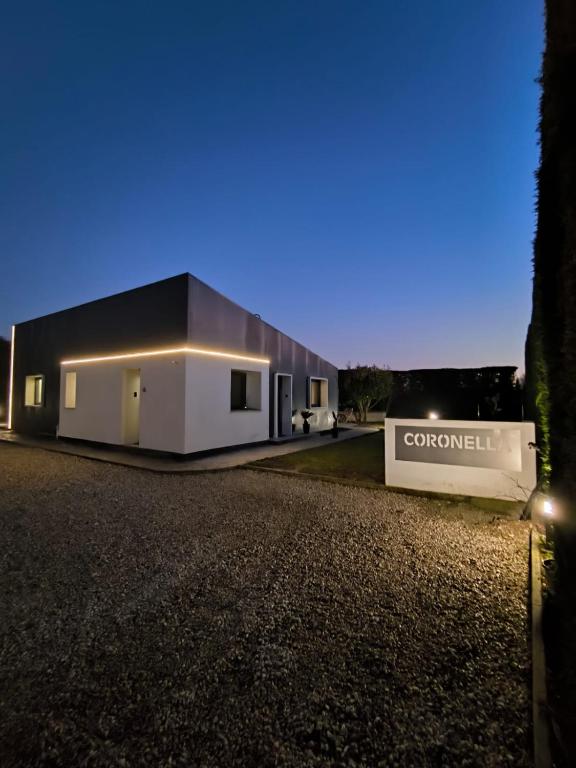 a black and white building with a sign in front of it at Suite Home Ferrara in Ferrara