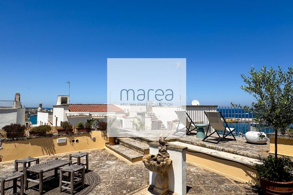 a large sign that says marea on a building at La Torretta - Authentic Historic House with Panoramic Sea-View Terrace in Otranto Old Town - Marea Stays Collection in Otranto