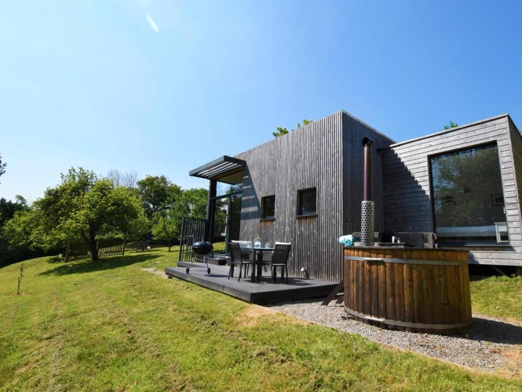 a tiny house with a grill and a table at 2 Bed in Brecon oc-59733 in Talgarth