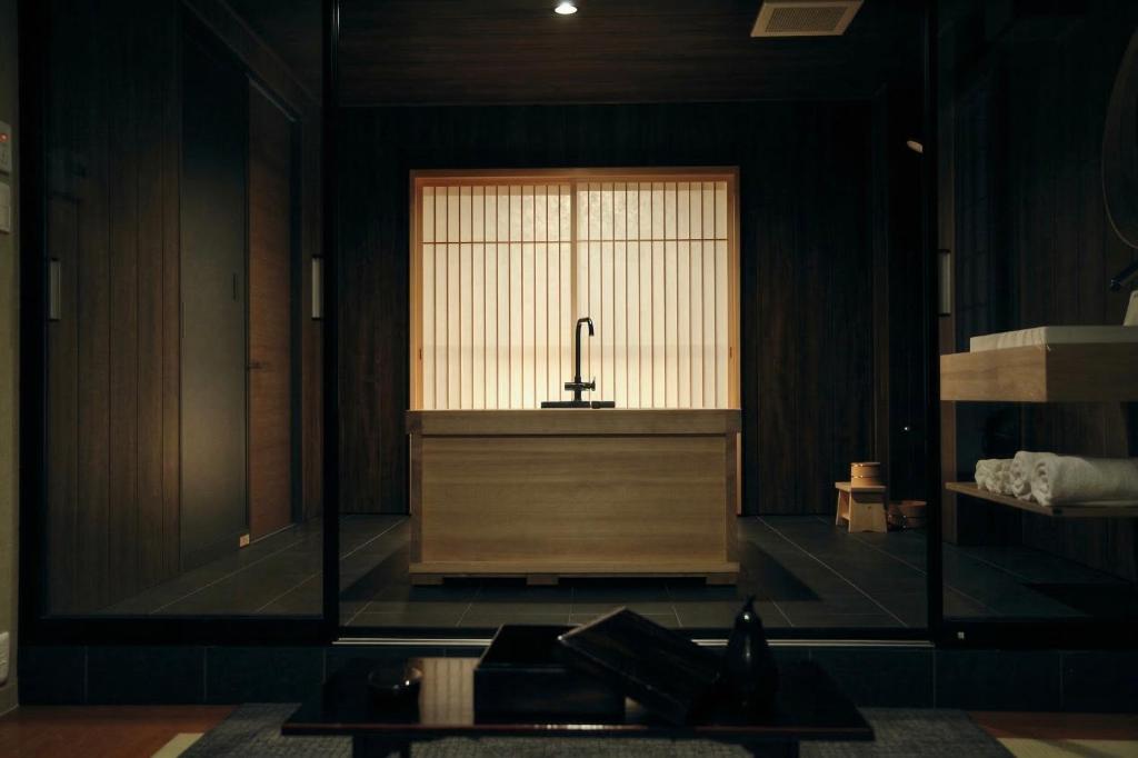 a large room with a large window with a sink in it at Ryokan Suzuri 旅館 すずり in Tokyo