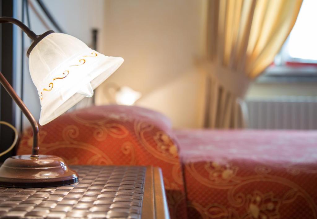 Postel nebo postele na pokoji v ubytování Hotel Aquadolce