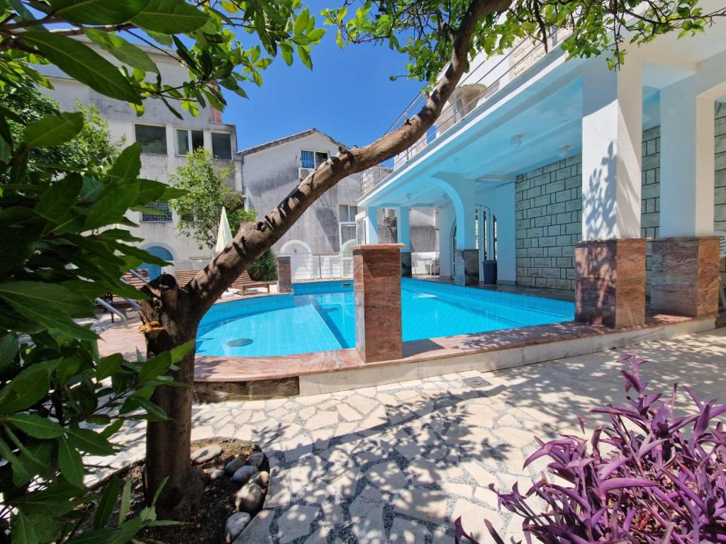 a pool in the backyard of a house at Adriatic Villa Matea in Budva