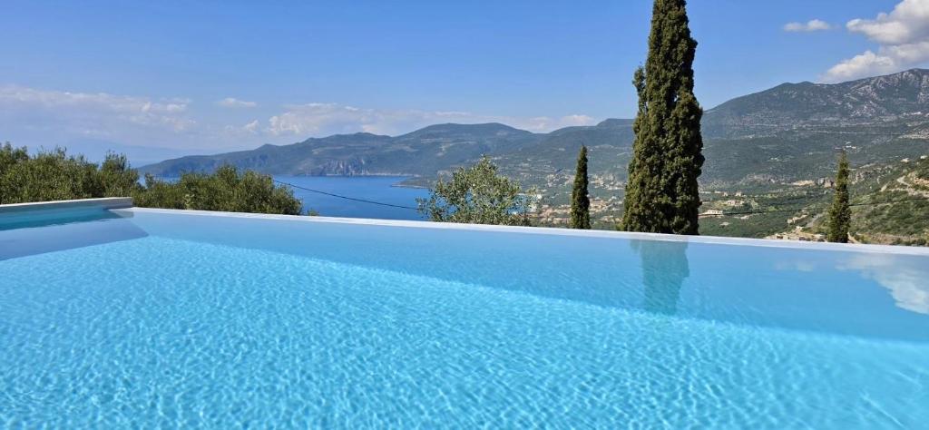 a swimming pool with a view of the mountains at Villa Piedra Azul in Kardamyli