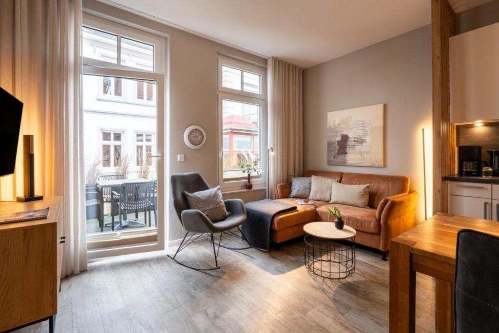 a living room with a couch and a table at Pier17 Appartement 1 in Borkum