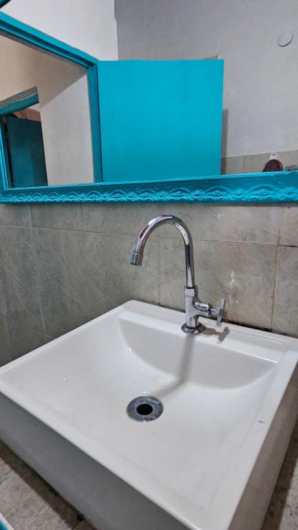 a white sink in a bathroom with a mirror at Prueba in San Vicente