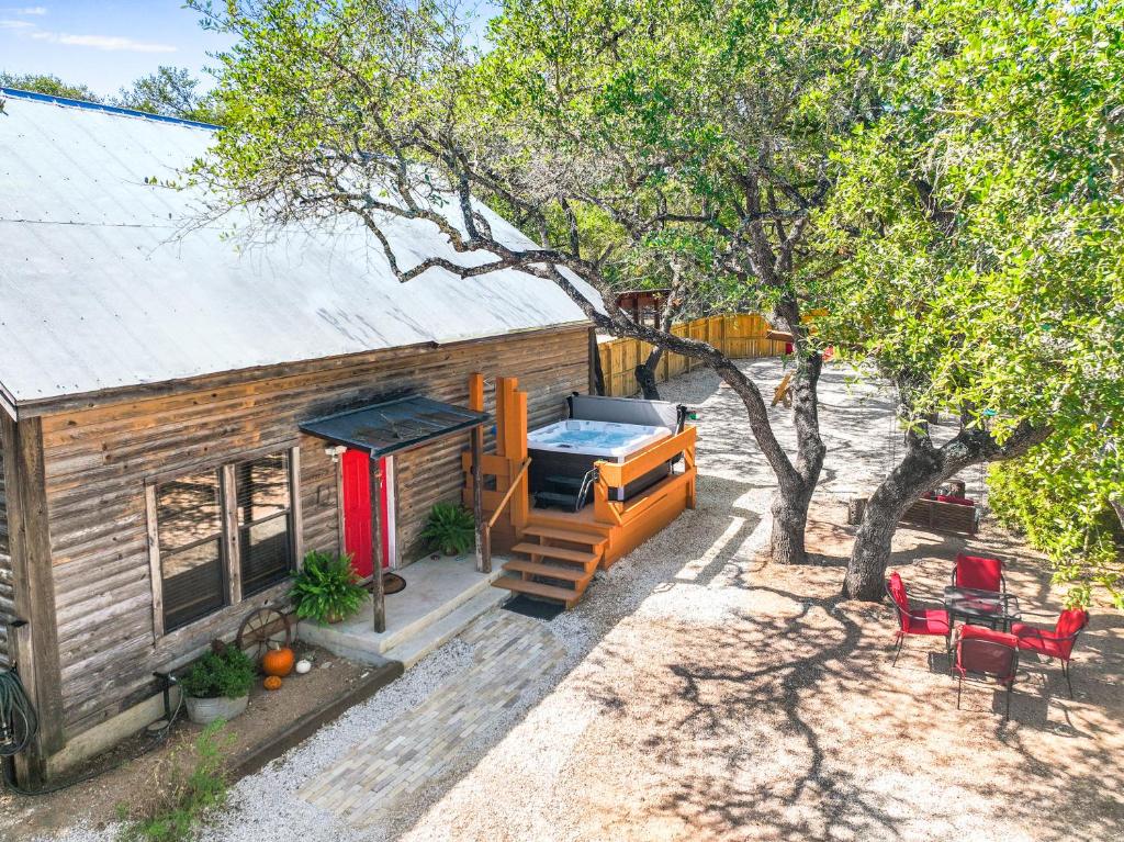 an aerial view of a tiny house with a grill at Happy Hideaway in Wimberley