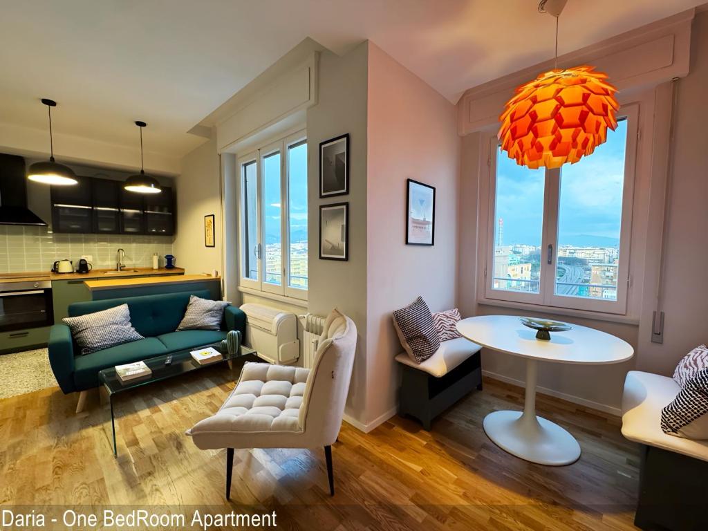 a living room with a couch and a table at Saverio & Daria Aprtements by Mamo Florence in Florence