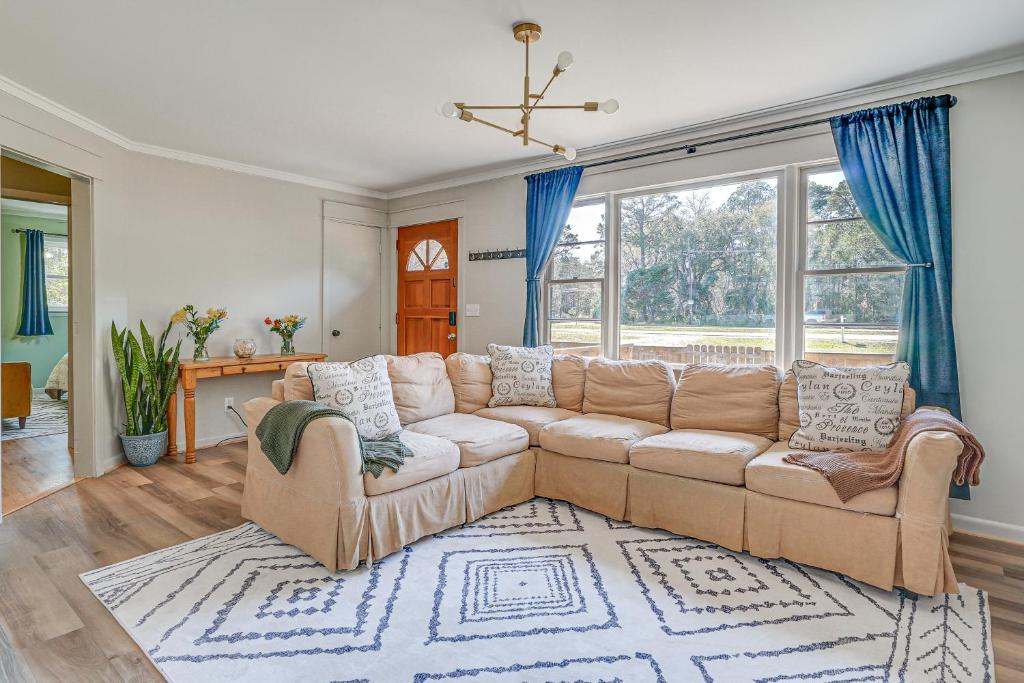 a living room with a couch and a rug at Deck & Spacious Yard! Wilmington Gem on Half-Acre in Wilmington